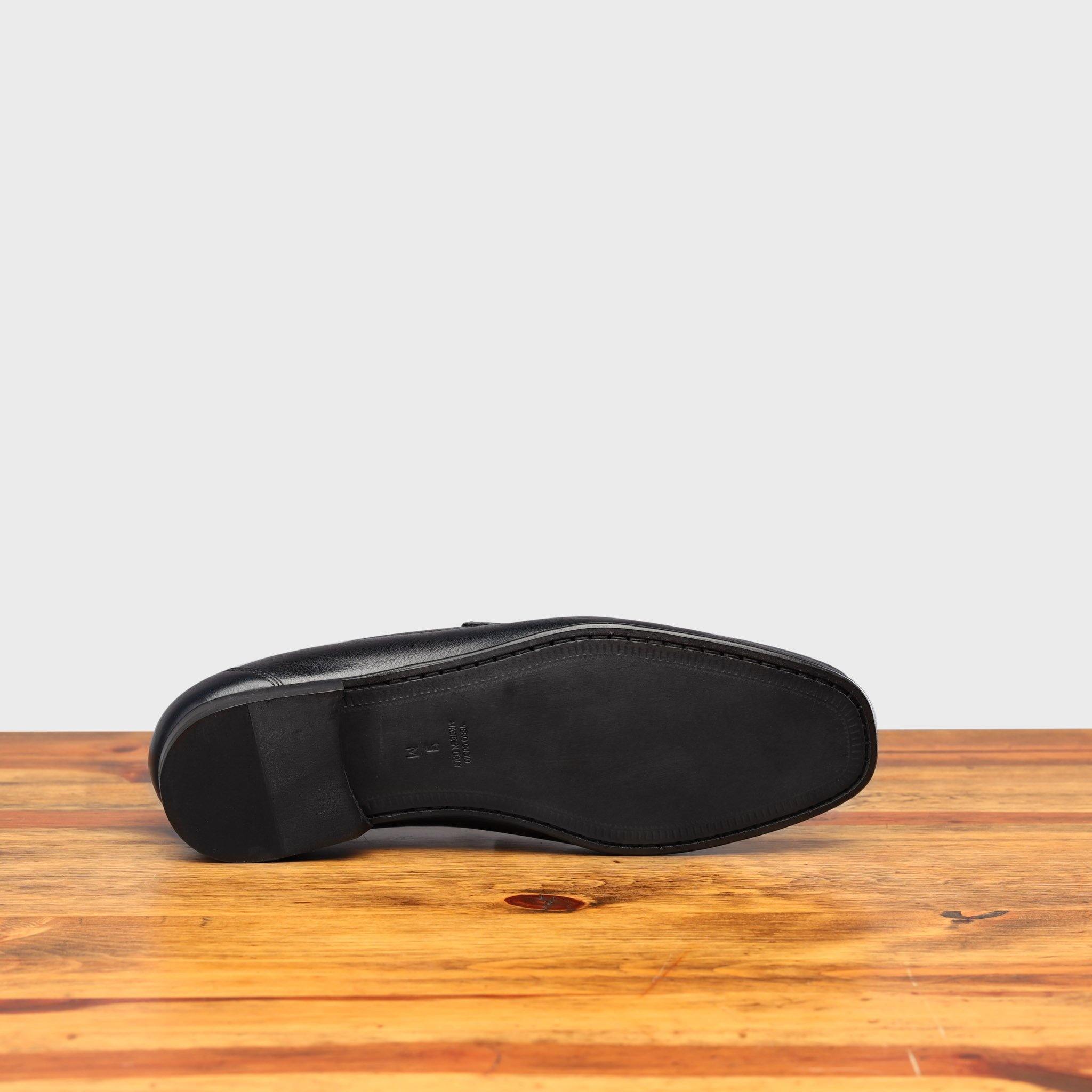 Full leather outsole of 8616-M Calzoleria Toscana Blue Buff Calf Slip-on on top of a wooden table